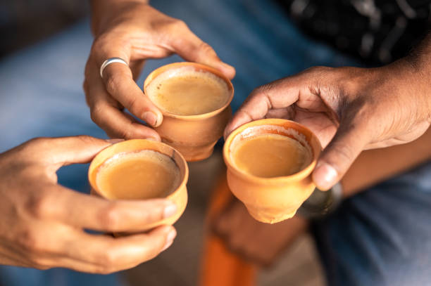 Drinking Chai tea with milk in earthen cups in India